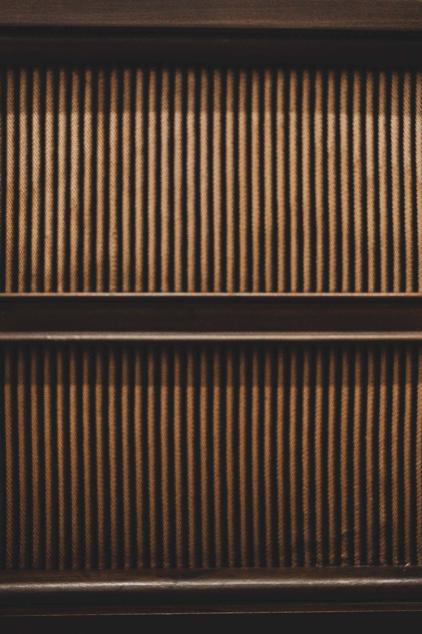 Vertical slatted grille on a vintage console